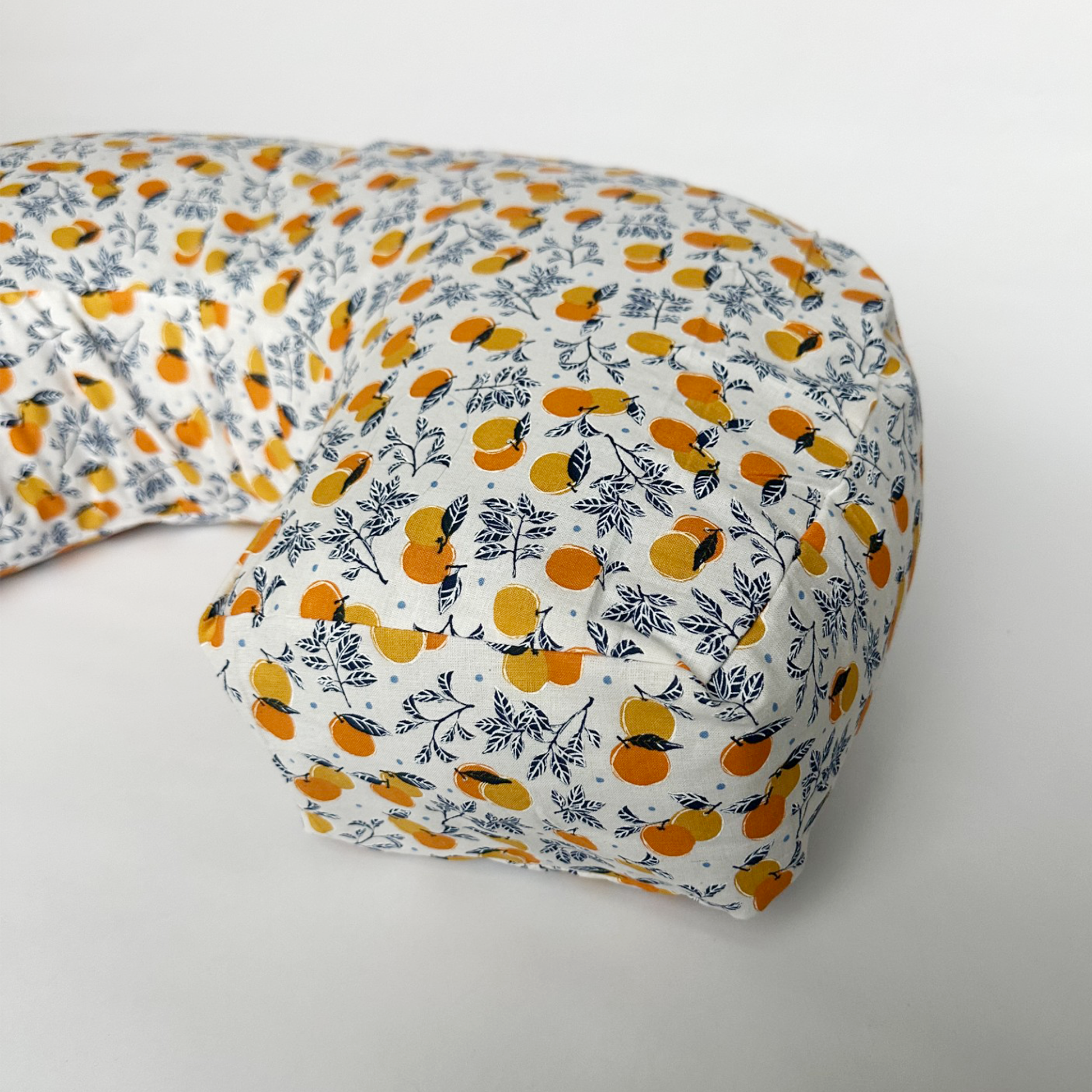 organic nursing pillow with orange illustration