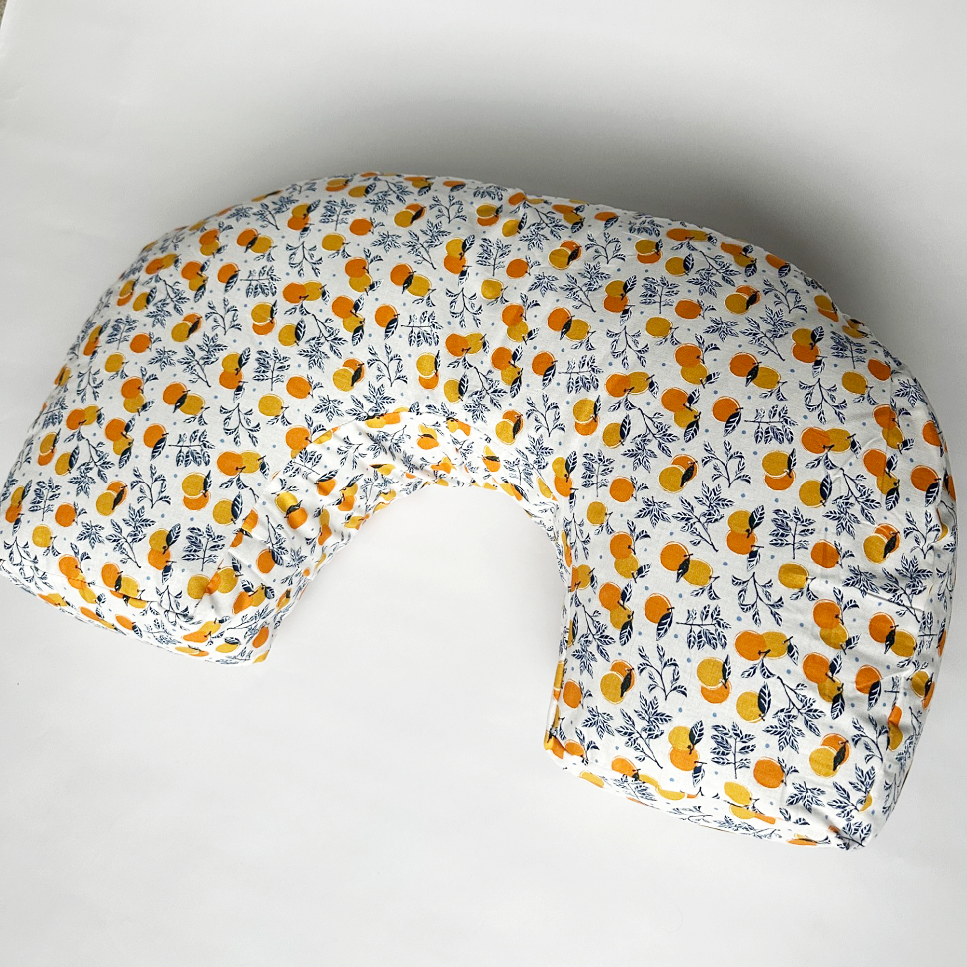 organic nursing pillow with tangerine illustration